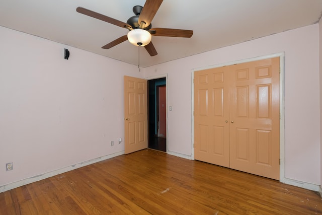 17590 New Columbus Rd, Corinth, KY 41010 - unfurnished bedroom with ceiling fan, a closet, and wood finished floors