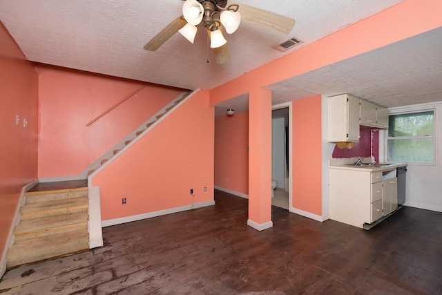 17590 New Columbus Rd, Corinth, KY 41010 - unfurnished living room featuring a textured ceiling, visible vents, stairway, dark wood-style flooring, and a ceiling fan