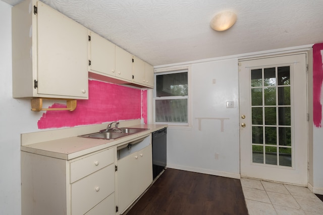 17590 New Columbus Rd, Corinth, KY 41010 - kitchen with light wood-style flooring, dishwasher, baseboards, a sink, and light countertops