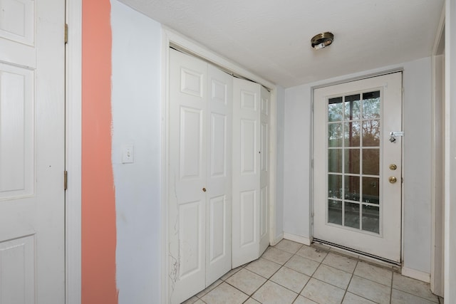 17590 New Columbus Rd, Corinth, KY 41010 - doorway to outside with a textured ceiling, baseboards, and light tile patterned flooring
