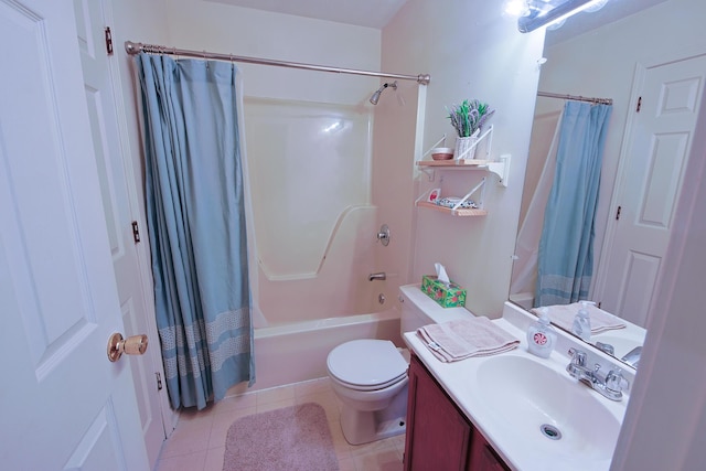 bathroom featuring toilet, tile patterned flooring, vanity, and shower / bath combo