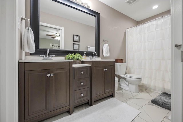 916 Auckland Ave, Richmond, KY 40475 - bathroom featuring marble finish floors, toilet, double vanity, ceiling fan, and recessed lighting