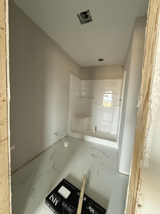 bathroom with marble finish floor