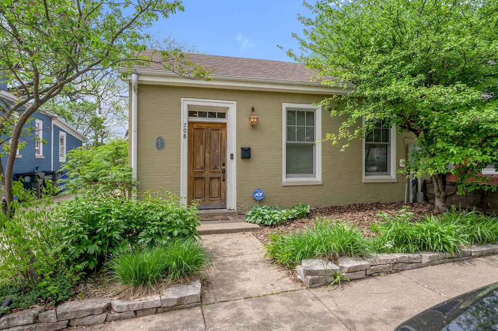 708 W Short St, Lexington, KY 40508 - view of front facade with roof with shingles and brick siding