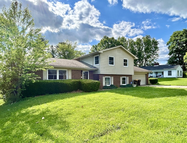 500 Meadowlark Dr, Somerset, KY 42503 - split level home featuring a front lawn, driveway, brick siding, and a garage