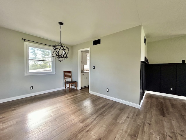 500 Meadowlark Dr, Somerset, KY 42503 - unfurnished dining area featuring visible vents, baseboards, a notable chandelier, and wood finished floors