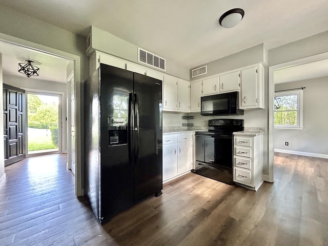 500 Meadowlark Dr, Somerset, KY 42503 - kitchen with black appliances, visible vents, white cabinetry, dark wood-style floors, and baseboards