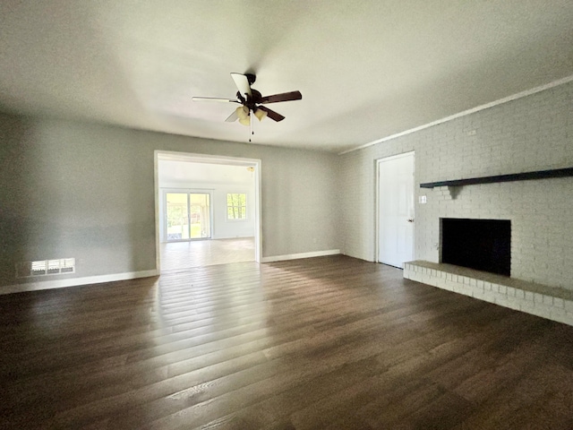 500 Meadowlark Dr, Somerset, KY 42503 - unfurnished living room with visible vents, ceiling fan, a brick fireplace, dark wood-style floors, and baseboards