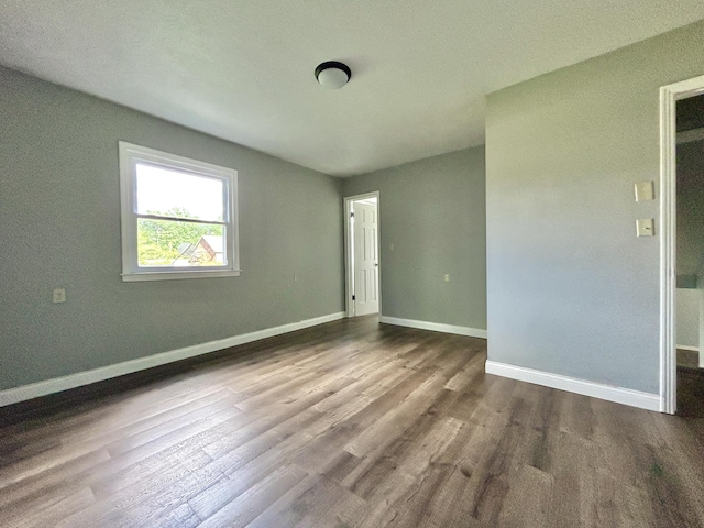 500 Meadowlark Dr, Somerset, KY 42503 - unfurnished bedroom featuring baseboards and dark wood-style floors