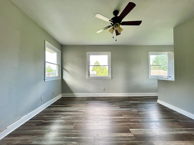 500 Meadowlark Dr, Somerset, KY 42503 - unfurnished room with baseboards, a wealth of natural light, ceiling fan, and dark wood-style flooring
