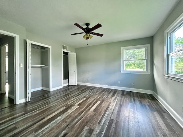 500 Meadowlark Dr, Somerset, KY 42503 - unfurnished bedroom featuring baseboards, dark wood finished floors, two closets, and a ceiling fan