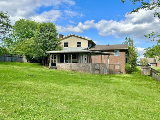 500 Meadowlark Dr, Somerset, KY 42503 - back of house featuring a lawn, a chimney, brick siding, and fence