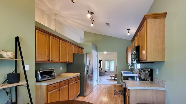 2204 Market Garden Ln, Lexington, KY 40509 - kitchen featuring stainless steel appliances, lofted ceiling, light wood-type flooring, light countertops, and brown cabinets