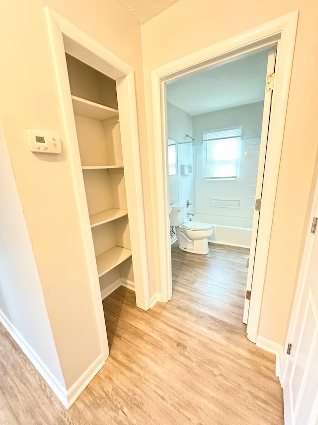 564 Ohio St, Lexington, KY 40508 - hallway with light wood finished floors and baseboards