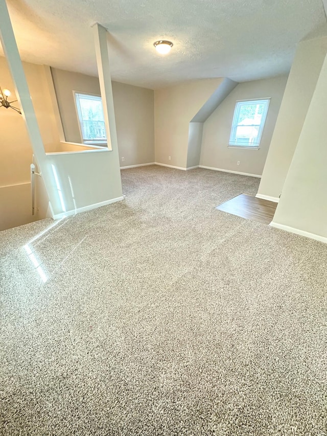 564 Ohio St, Lexington, KY 40508 - bonus room with a textured ceiling, carpet, and baseboards