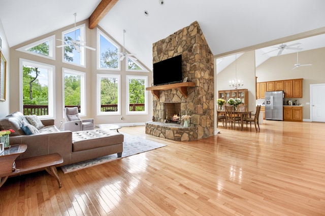 1117 Cliffs Edge Rd, East Bernstadt, KY 40729 - living area with high vaulted ceiling, a ceiling fan, light wood-type flooring, beam ceiling, and healthy amount of natural light