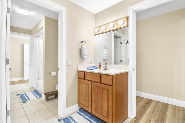 1117 Cliffs Edge Rd, East Bernstadt, KY 40729 - full bathroom with vanity, toilet, and baseboards