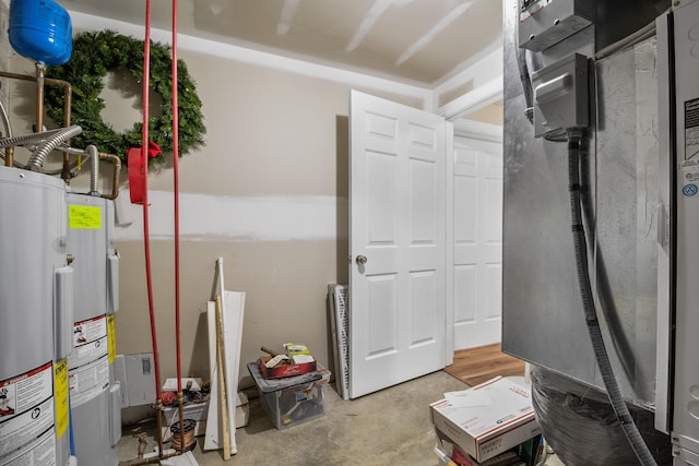 1117 Cliffs Edge Rd, East Bernstadt, KY 40729 - utility room with electric water heater and water heater