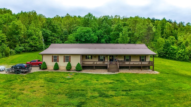 315 Sukey Hollow Rd, Williamsburg, KY 40769 - ranch-style house featuring covered porch, a forest view, a front yard, and metal roof