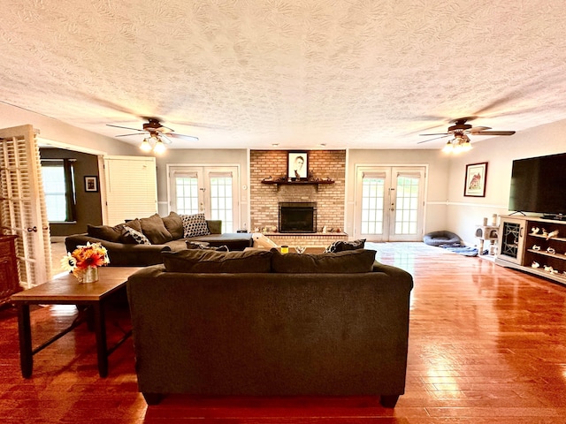 315 Sukey Hollow Rd, Williamsburg, KY 40769 - living room featuring ceiling fan, hardwood / wood-style floors, healthy amount of natural light, and a textured ceiling