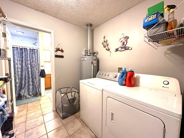 315 Sukey Hollow Rd, Williamsburg, KY 40769 - laundry room featuring water heater, separate washer and dryer, and light tile patterned floors