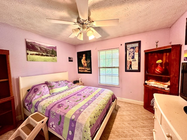 315 Sukey Hollow Rd, Williamsburg, KY 40769 - bedroom featuring a textured ceiling, light colored carpet, ceiling fan, and baseboards