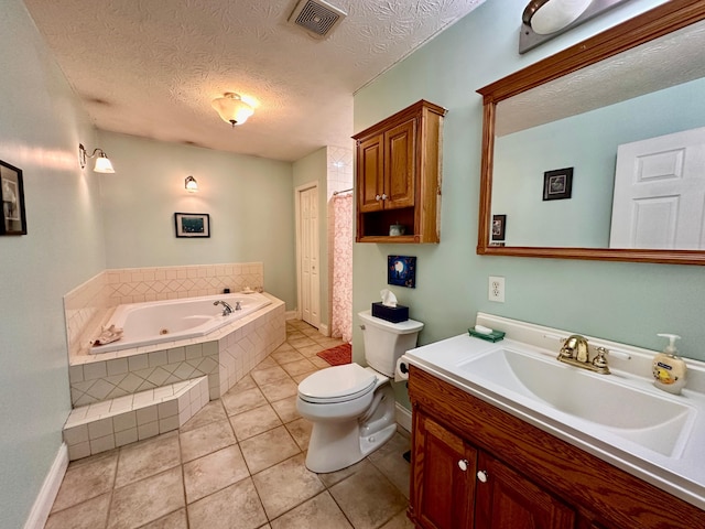 315 Sukey Hollow Rd, Williamsburg, KY 40769 - full bath featuring a jetted tub, a textured ceiling, vanity, toilet, and tile patterned flooring