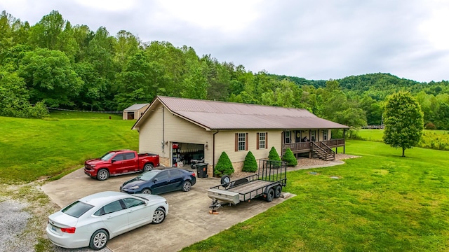 315 Sukey Hollow Rd, Williamsburg, KY 40769 - view of front of house featuring a wooded view, stairway, a porch, metal roof, and a front lawn