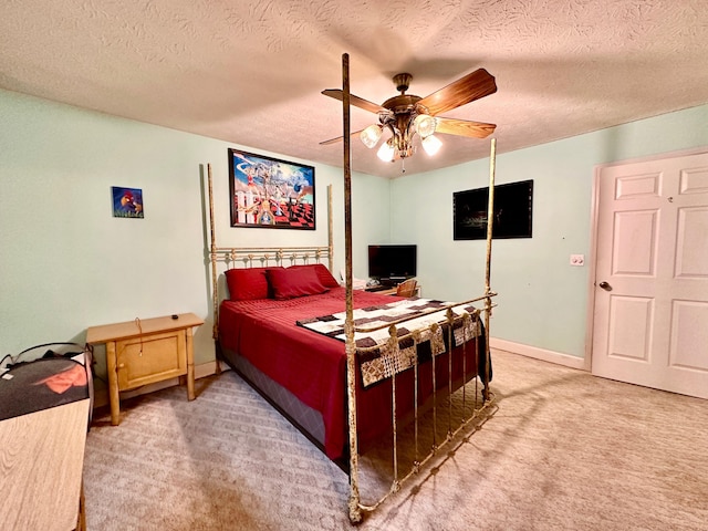 315 Sukey Hollow Rd, Williamsburg, KY 40769 - bedroom featuring light colored carpet, a textured ceiling, a ceiling fan, and baseboards