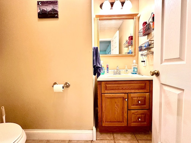 315 Sukey Hollow Rd, Williamsburg, KY 40769 - half bath with vanity, toilet, tile patterned floors, and baseboards