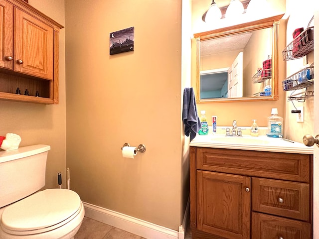 315 Sukey Hollow Rd, Williamsburg, KY 40769 - half bathroom featuring tile patterned flooring, toilet, vanity, and baseboards