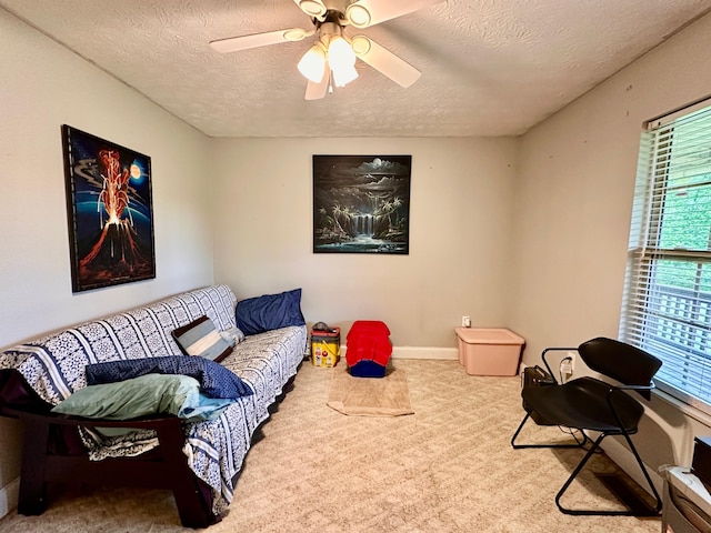 315 Sukey Hollow Rd, Williamsburg, KY 40769 - carpeted living area with a textured ceiling, ceiling fan, and baseboards