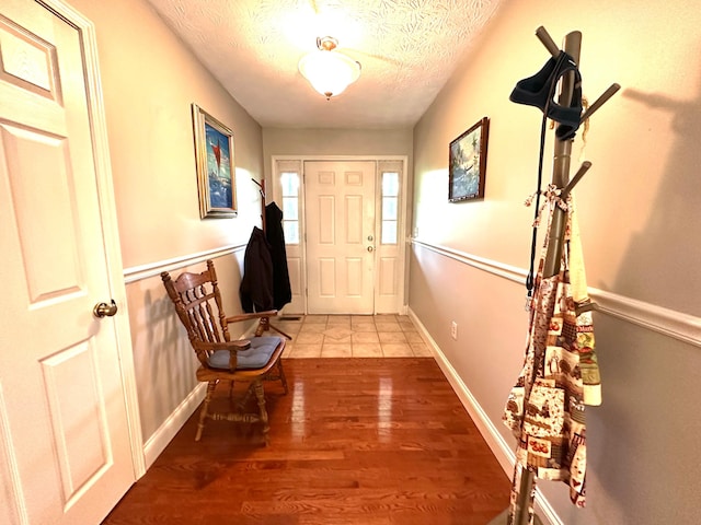 315 Sukey Hollow Rd, Williamsburg, KY 40769 - foyer entrance featuring a textured ceiling and wood finished floors