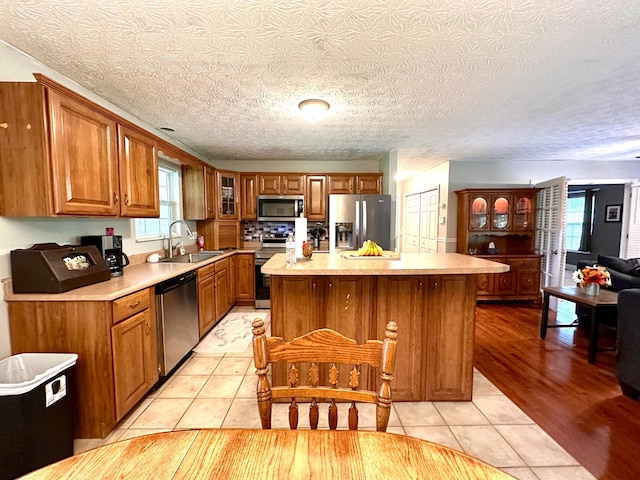 315 Sukey Hollow Rd, Williamsburg, KY 40769 - kitchen featuring appliances with stainless steel finishes, a sink, and brown cabinetry