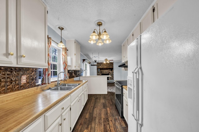 324 Circle Dr, Morehead, KY 40351 - kitchen with white fridge with ice dispenser, a sink, dark wood finished floors, stainless steel range with electric stovetop, and white cabinets