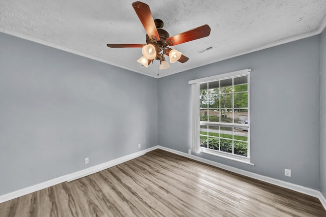 324 Circle Dr, Morehead, KY 40351 - spare room featuring wood finished floors, baseboards, a ceiling fan, crown molding, and a textured ceiling