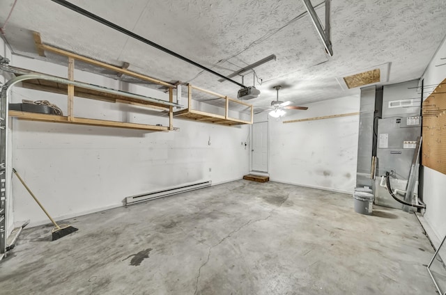 324 Circle Dr, Morehead, KY 40351 - garage featuring baseboard heating, a garage door opener, and a ceiling fan