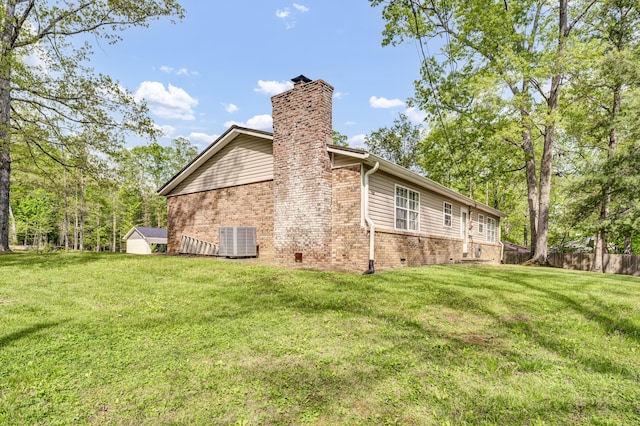 324 Circle Dr, Morehead, KY 40351 - view of side of home with central AC, brick siding, and a chimney