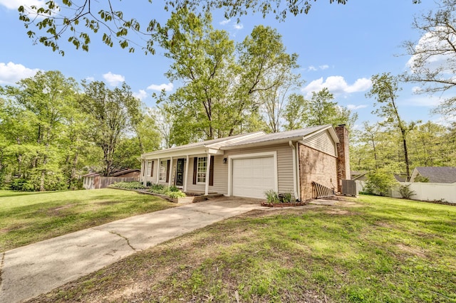324 Circle Dr, Morehead, KY 40351 - view of front facade with a garage, a chimney, concrete driveway, and cooling unit