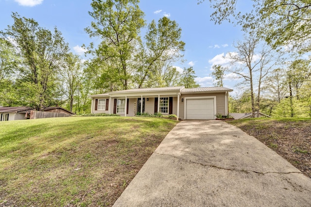 324 Circle Dr, Morehead, KY 40351 - single story home featuring a garage, driveway, a front lawn, metal roof, and a porch