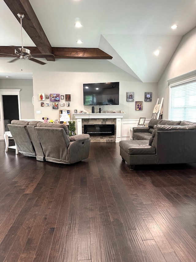 living room with ceiling fan, dark wood-style flooring, a glass covered fireplace, recessed lighting, and lofted ceiling