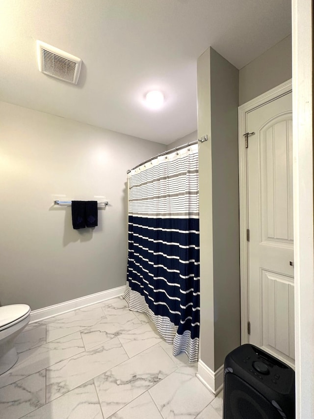 bathroom with baseboards, marble look tiles, toilet, and a shower with shower curtain