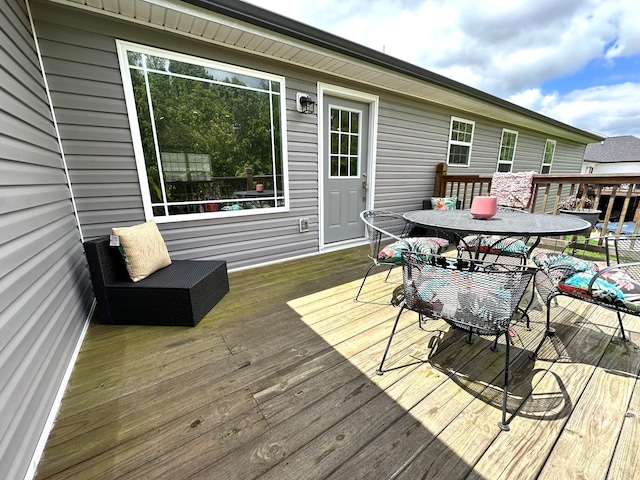 deck with outdoor dining space