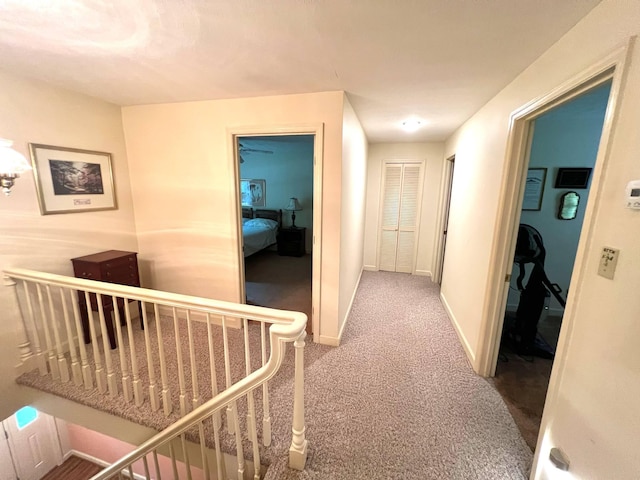 4758 Cloverlick Rd, Cumberland, KY 40823 - hall featuring carpet flooring, baseboards, and an upstairs landing