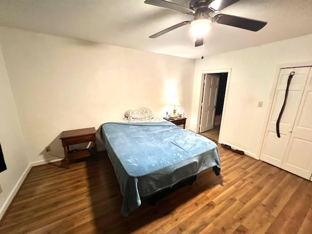 4758 Cloverlick Rd, Cumberland, KY 40823 - bedroom featuring wood finished floors, baseboards, and a ceiling fan