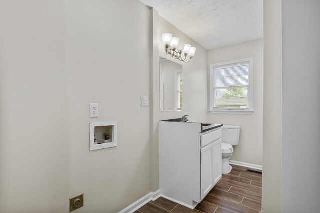 340 Wise Dr, Wilmore, KY 40390 - bathroom featuring baseboards, toilet, wood tiled floors, vanity, and a textured ceiling