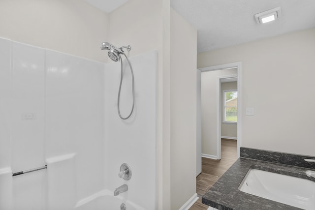 340 Wise Dr, Wilmore, KY 40390 - bathroom featuring a sink, shower / tub combination, baseboards, and wood finished floors
