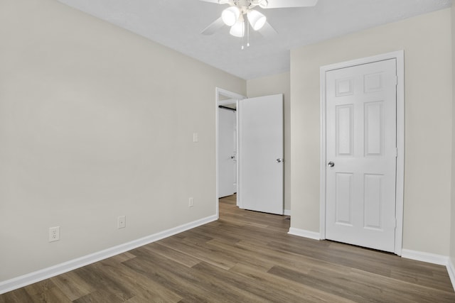 340 Wise Dr, Wilmore, KY 40390 - unfurnished bedroom with wood finished floors, baseboards, and ceiling fan