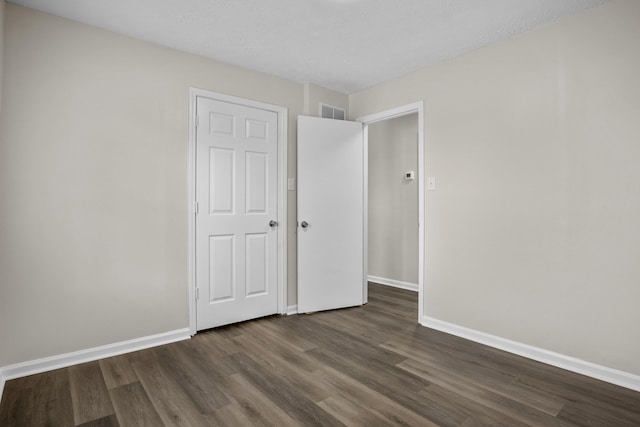 340 Wise Dr, Wilmore, KY 40390 - unfurnished bedroom featuring dark wood-style flooring and baseboards