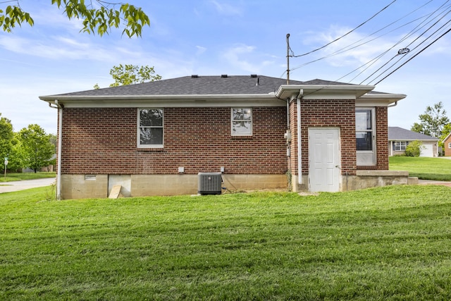 340 Wise Dr, Wilmore, KY 40390 - rear view of house with a yard, central AC, brick siding, and a shingled roof